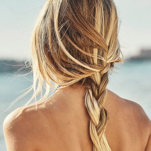 Closeup of a woman's braided hair at Marbella Club