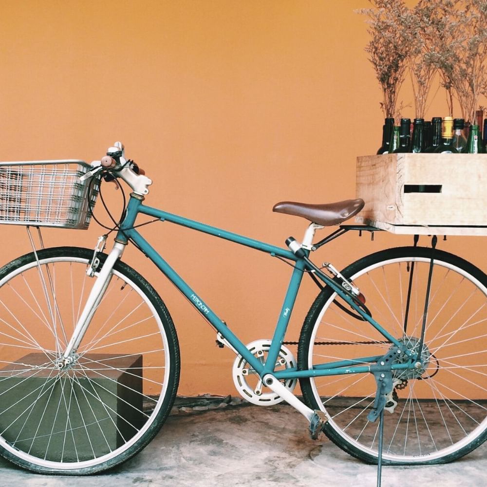 A bicycle with an attached wine box & basket near Waikiki Resort Hotel by Sono