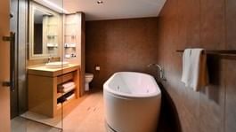 Deluxe Spa Room bathroom at Novotel Melbourne on Collins