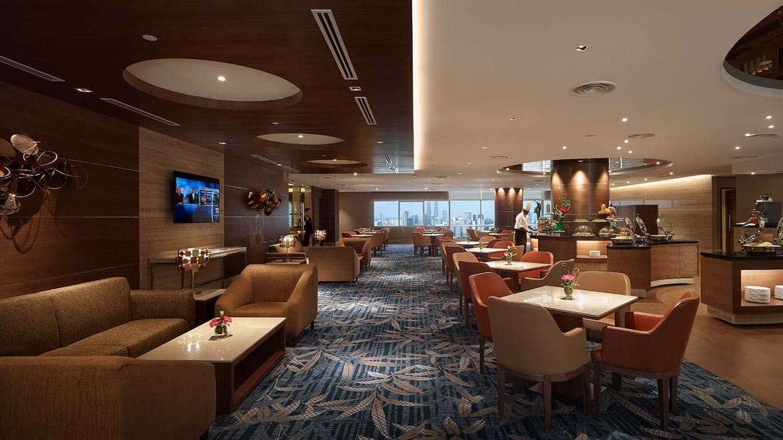 Interior view of The Club Lounge with carpeted floors & comfy seating area at Sunway Hotels & Resorts