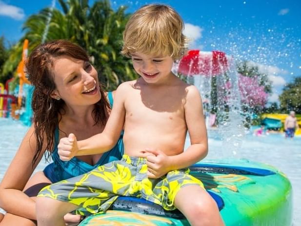 A mother and son play at a splash pad in Aquatica, soon to be home to Turi's Kid Cove.