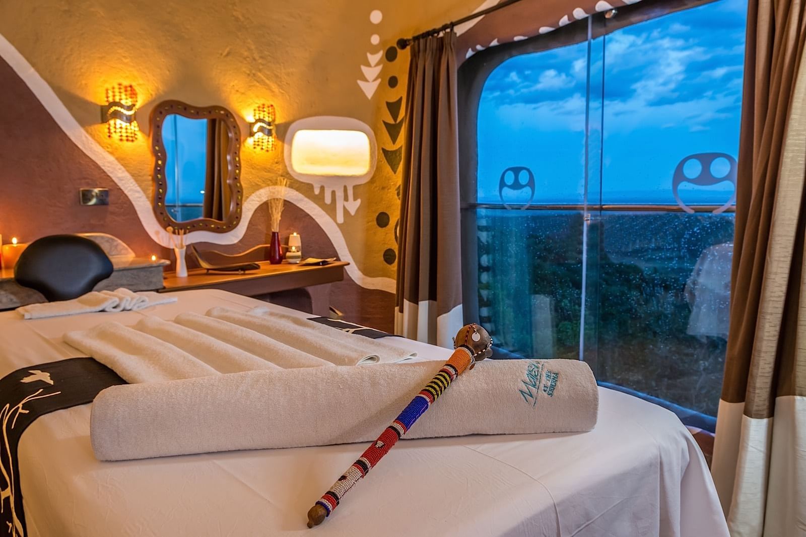 View of a treatment room with a bed at Mara Serena Safari Lodge