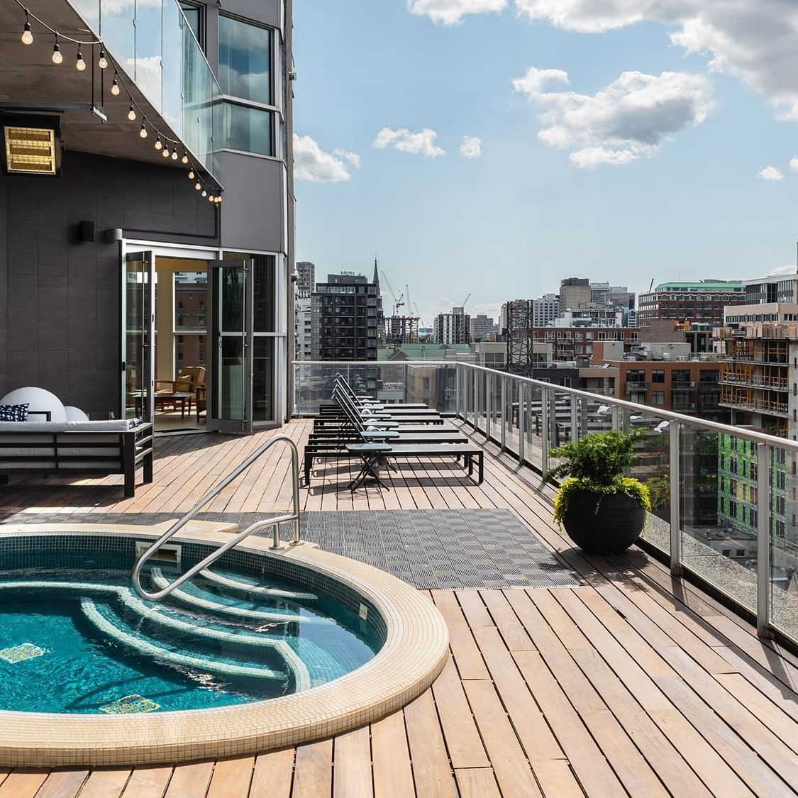 Outdoor mini pool with lounge at Warwick Le Crystal - Montreal