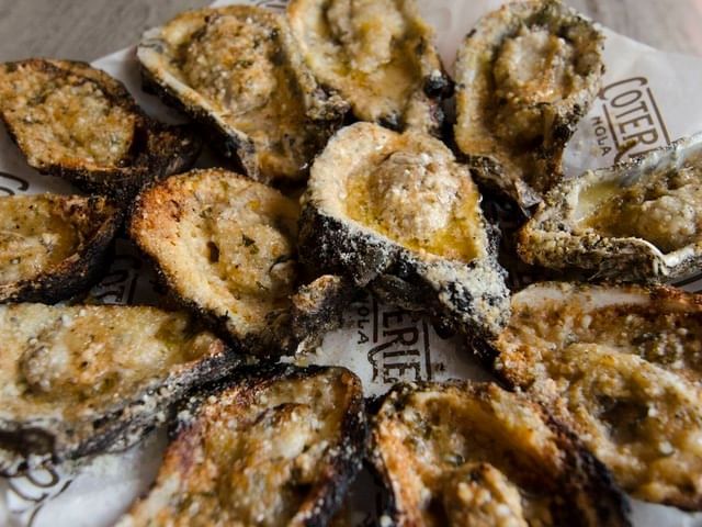 Char grilled oysters served at a shop near La Galerie Hotel