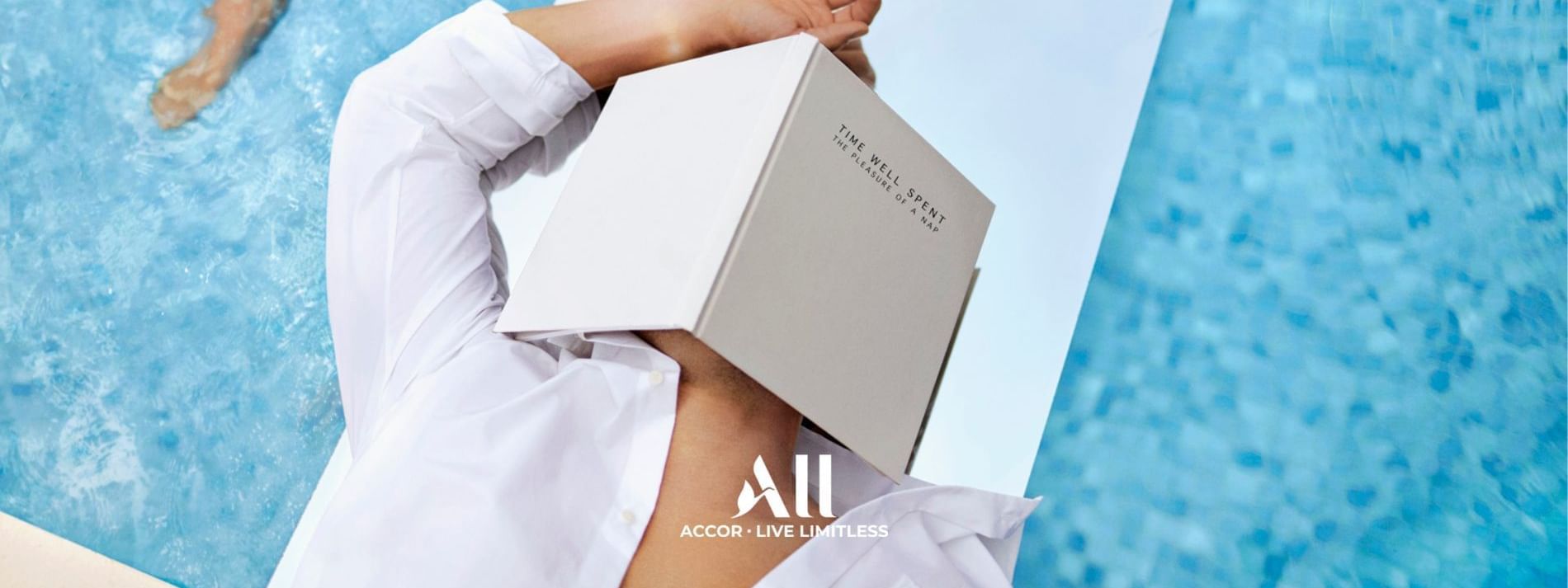 Accor Live Limitless poster showing a person relaxing by the pool at Novotel Sydney International Airport