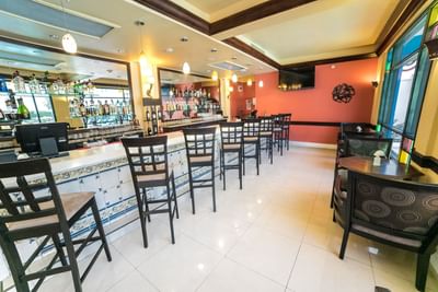 bar with bar stools and tables