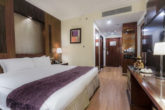 Bed & hallway in Transient Double Room at Elaf Kinda Hotel