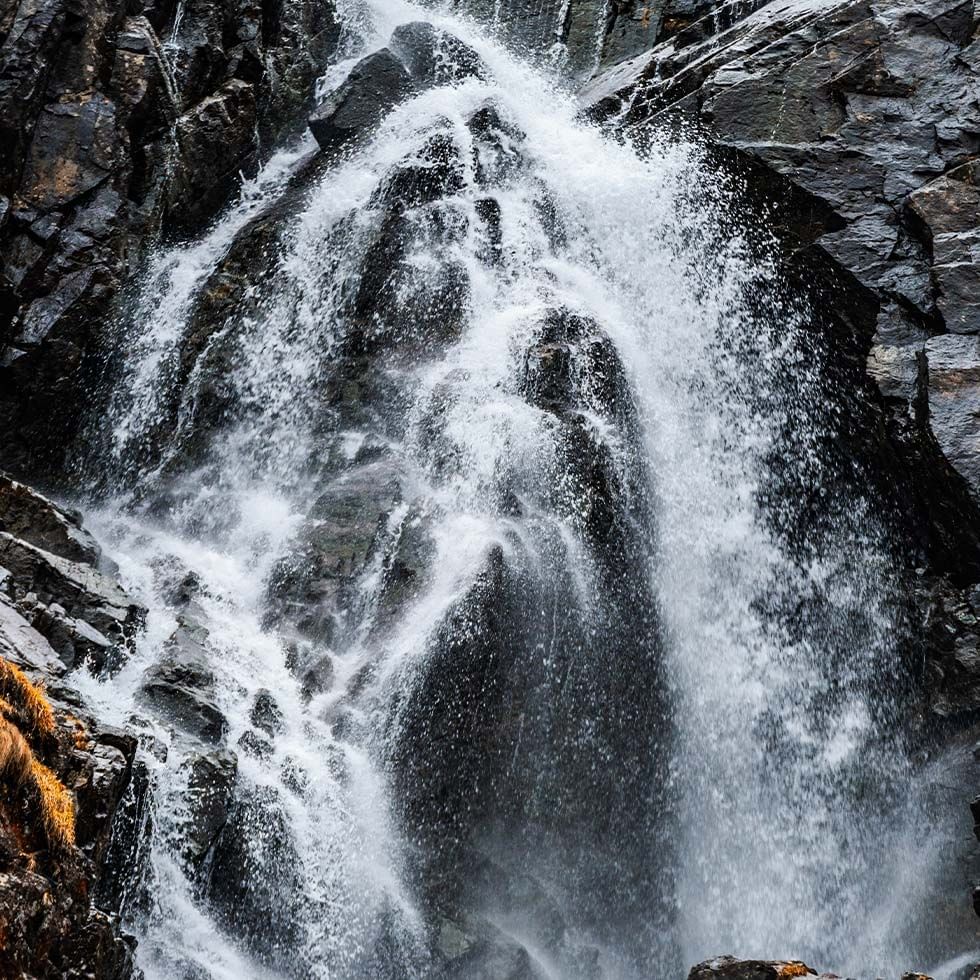 A stunning view of a waterfall near Falkensteiner Hotels