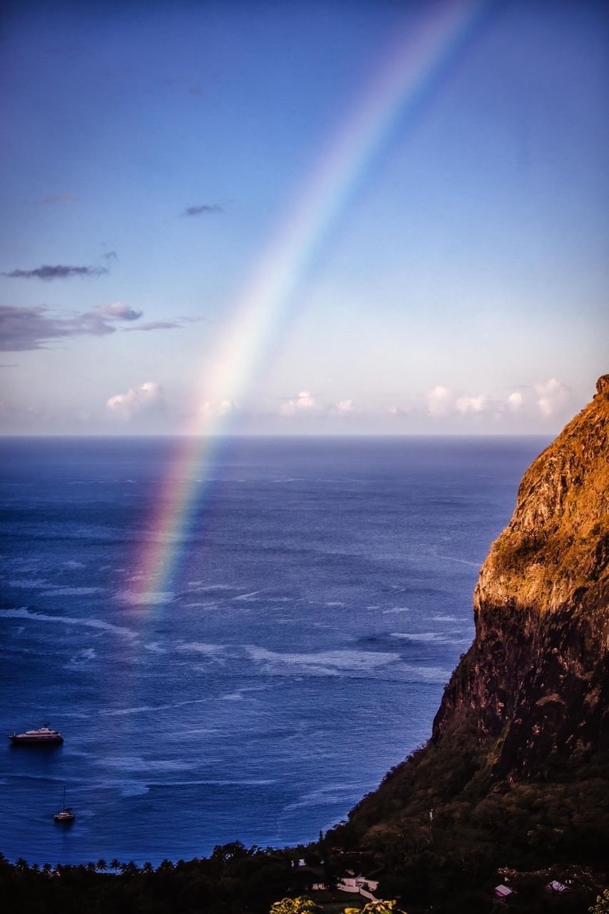 Distant view of the sea with a rainbow near Pitons St Lucia Resort