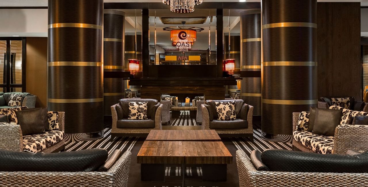 Hotel Lobby with couch, chandelier, tables, and mirrors