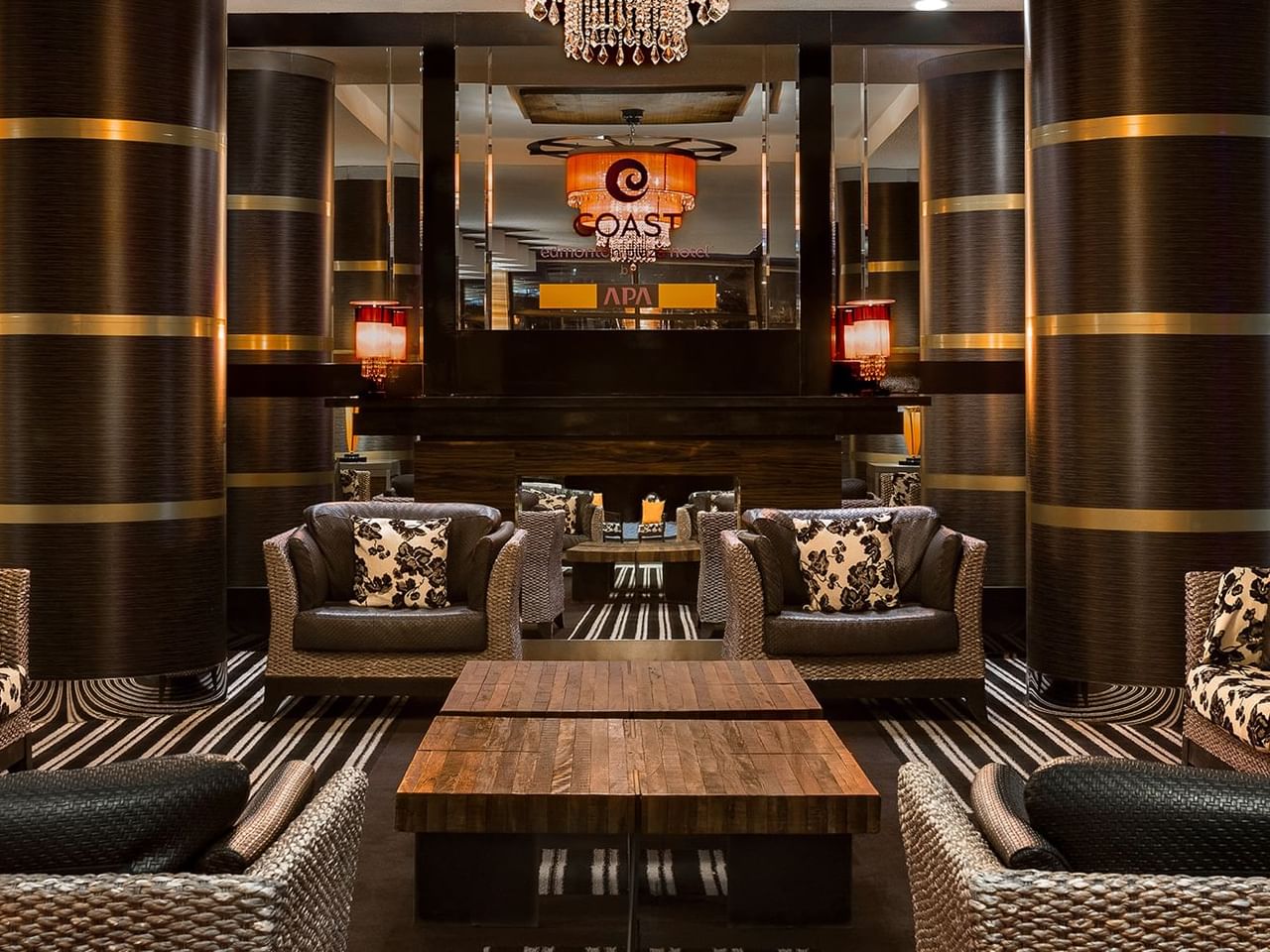 Hotel Lobby with couch, chandelier, tables, and mirrors