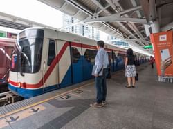 People at Phrom Phong BTS Station near Chatrium Hotel Bangkok