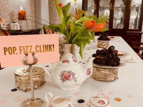 tea pots and fruits on a table