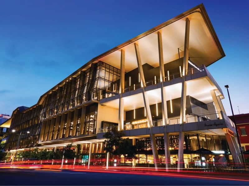BCEC building with illuminated interior near Sofitel Brisbane Central
