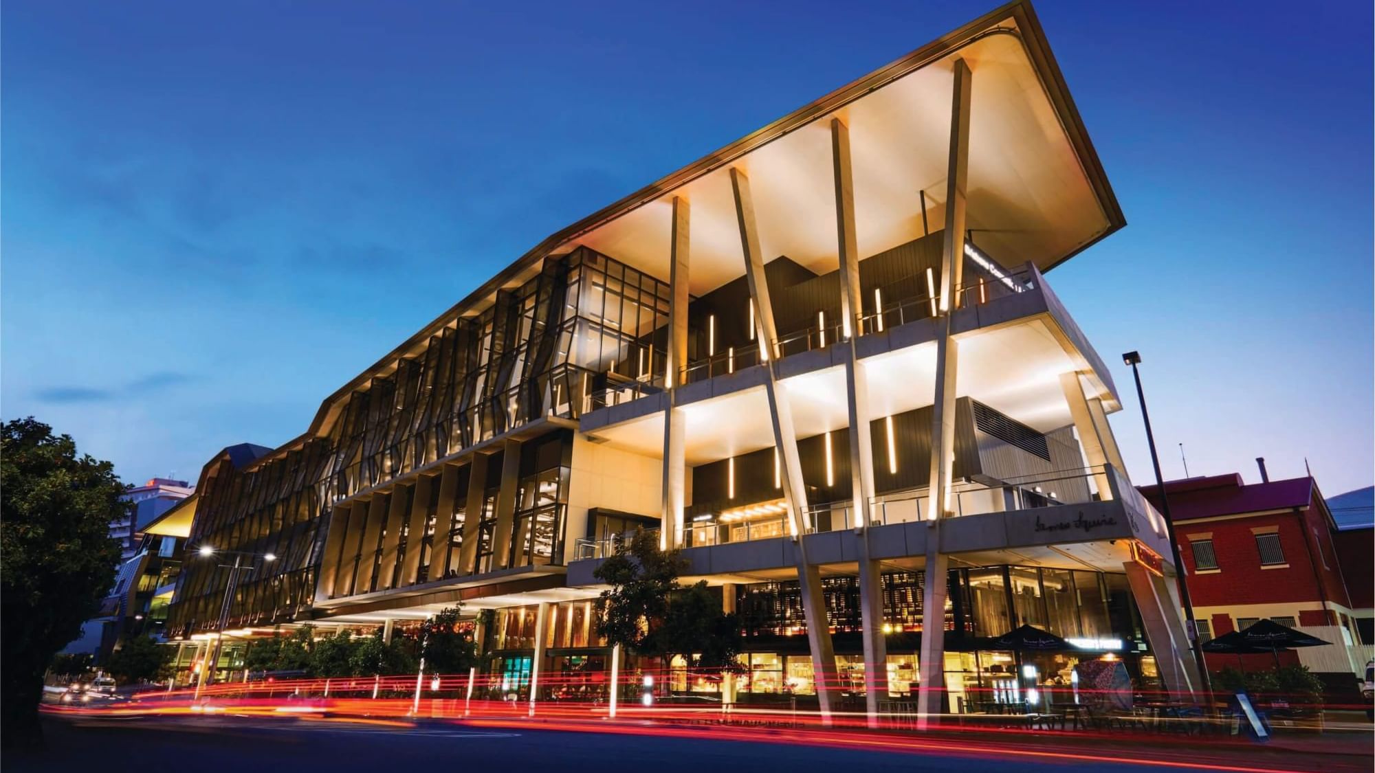 BCEC building with illuminated interior near Sofitel Brisbane Central