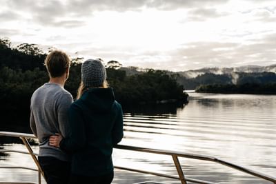 Couple watching the River from the ship at Gordon River Cruise