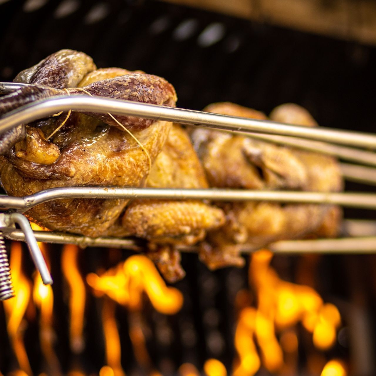 Roast chicken in the rotisserie at Domaine De Manville
