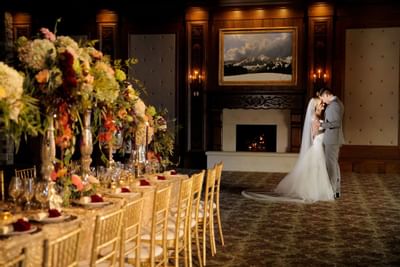 A wedded couple dancing in a ballroom in Stein Eriksen Lodge