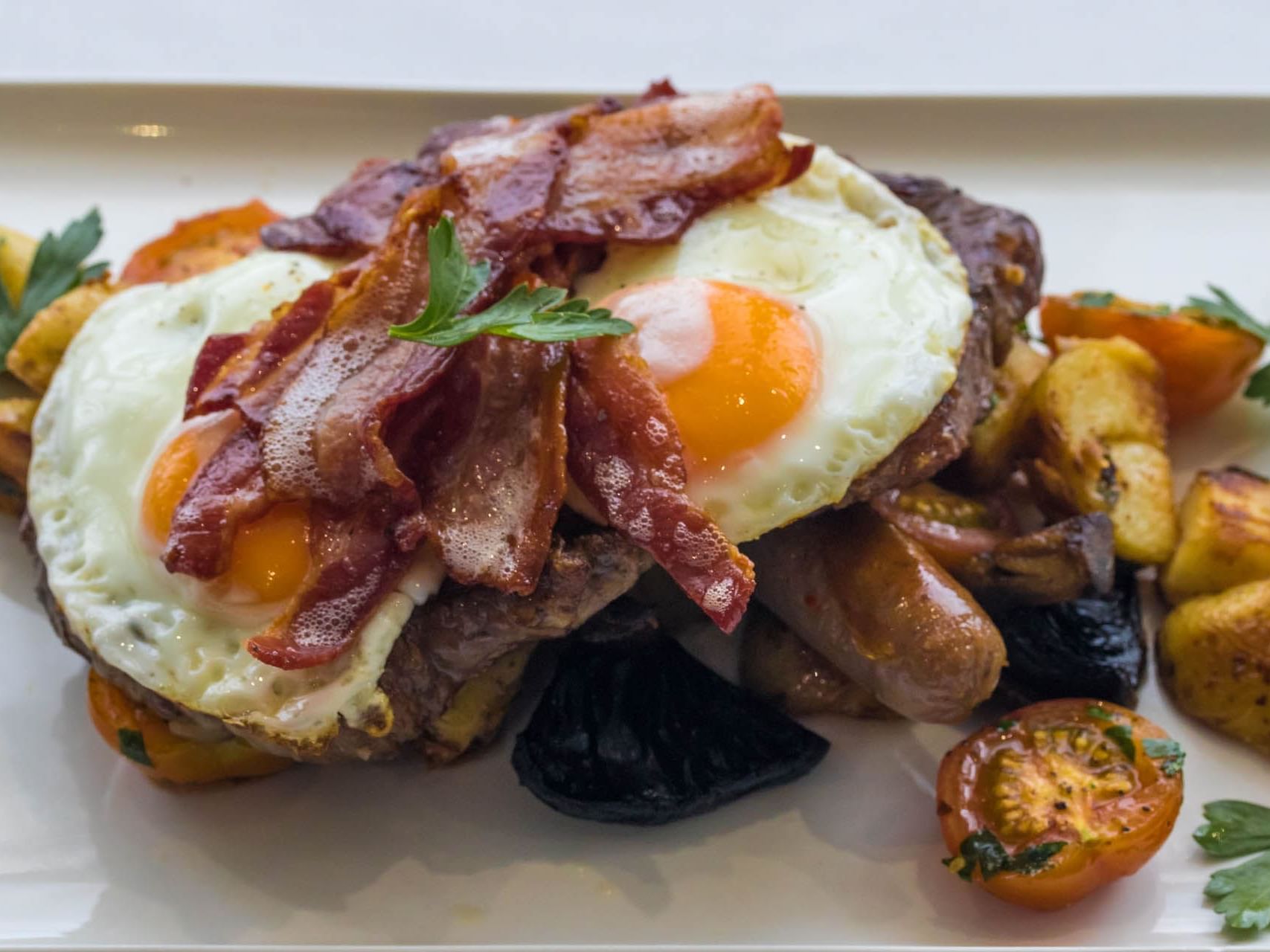 Eggs, bacon, sausage & potato dish served at Grand Chancellor Townsville