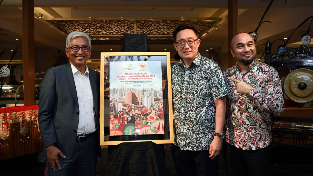 Hotel staff holding with an award at Sunway Putra Hotel