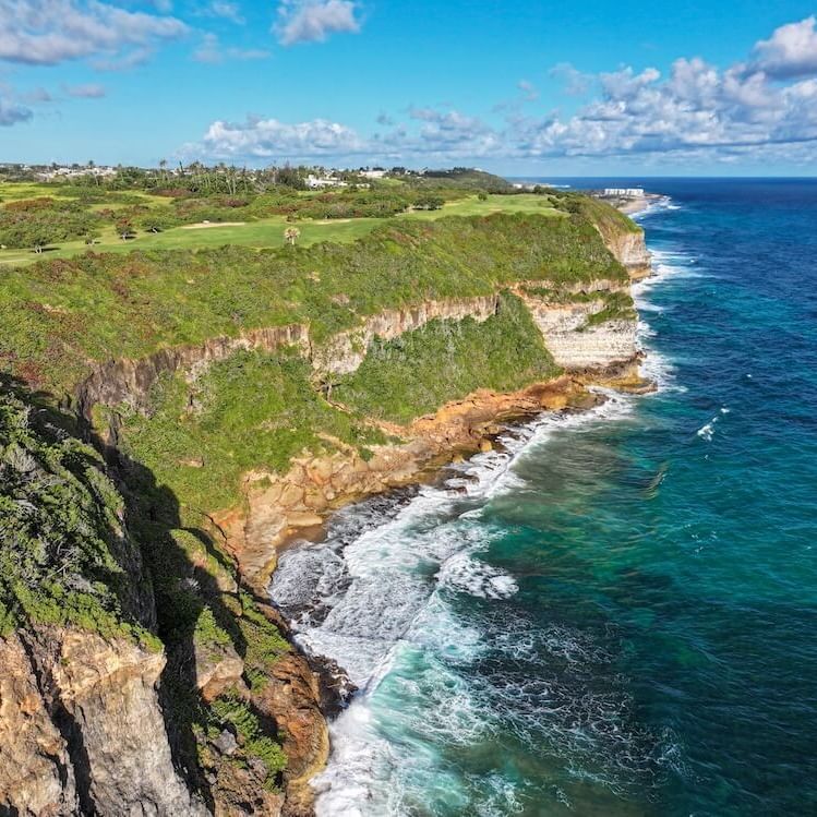 cliffside championship golf with ocean views at Royal Isabela