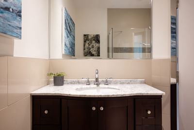 Bathroom with vanity & mirror in Queen Premiere at Retro Suites Hotel