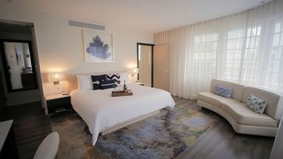 bed in cozy room with carpet