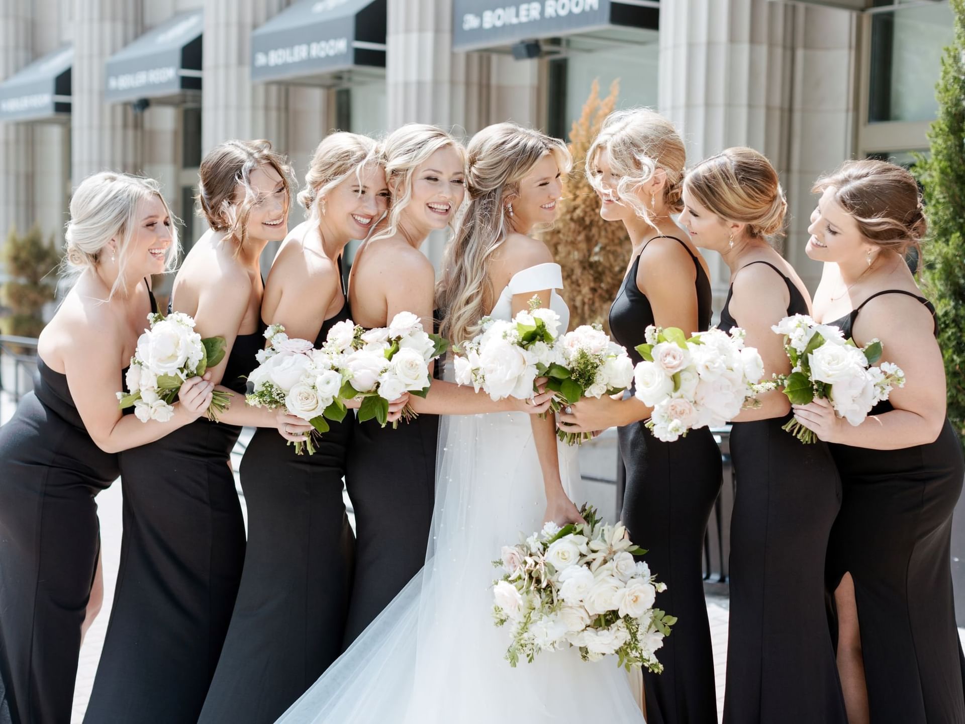 Bride & bridesmaids posing outside at The Mayo Hotel