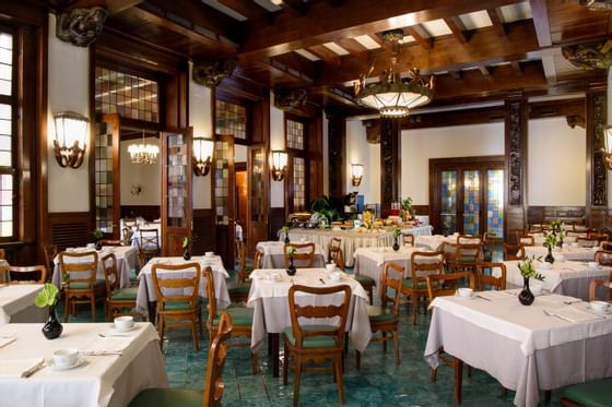 Dining tables set-up in Polene Breakfast Room at Bettoja Hotel Atlantico