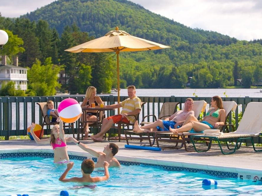Family enjoying the outdoor pool at High Peaks Resort