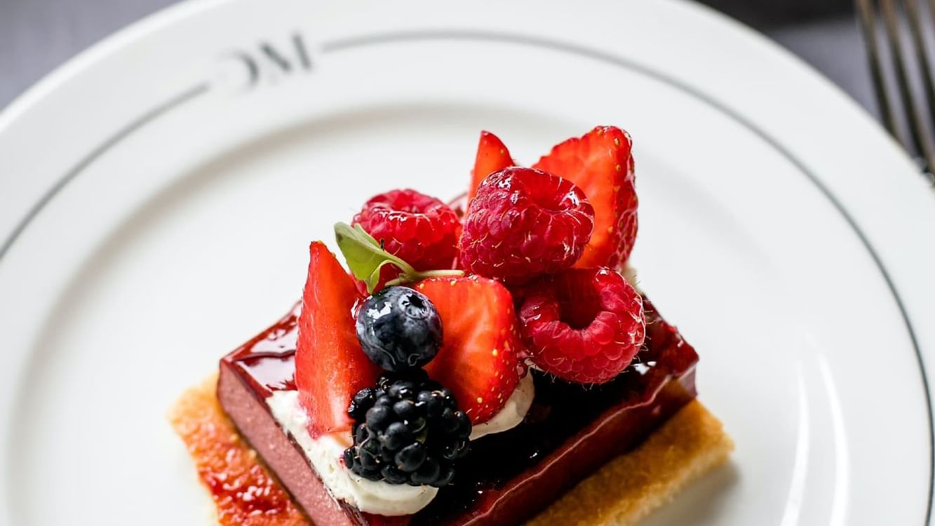Dessert with berries on top in The Bistro, Domaine de Manville