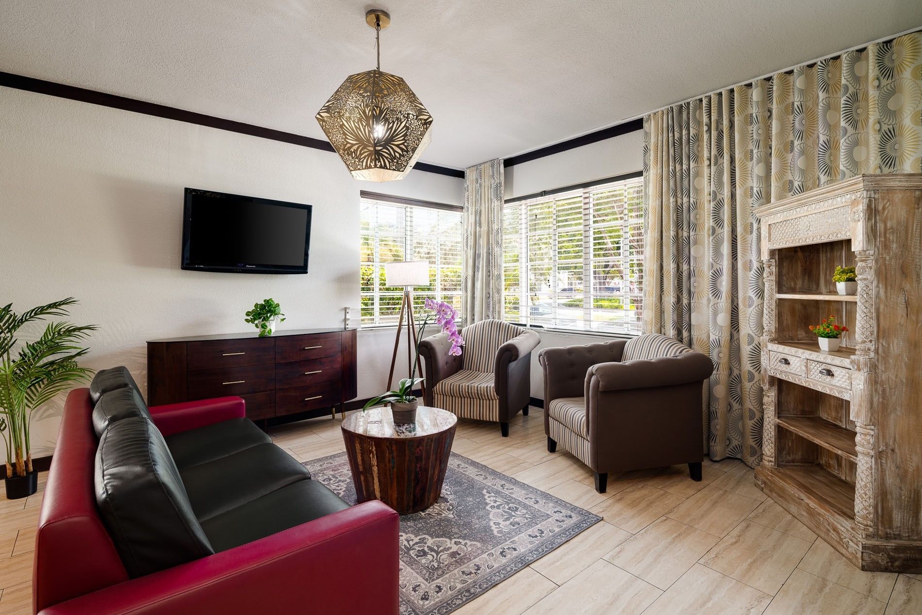 A hotel lobby with seating area and decor