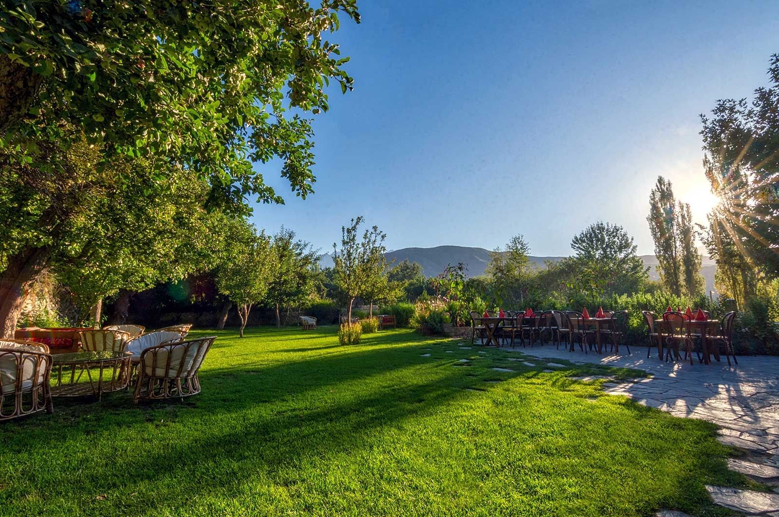 An Outdoor Lounge area in a garden at Serena Khaplu Palace
