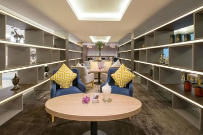 Sofa chairs with coffee tables in Executive lounge at Eastin Hotels