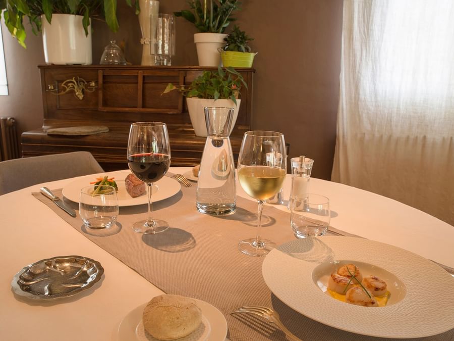 Fine dining setup in a restaurant at Hotel du Pont Roupt