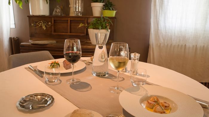 Fine dining setup in a restaurant at Hotel du Pont Roupt