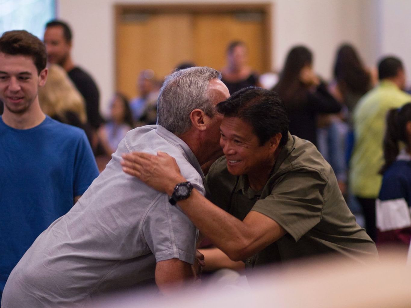 2 men embracing each other during an event at Easthampstead H.