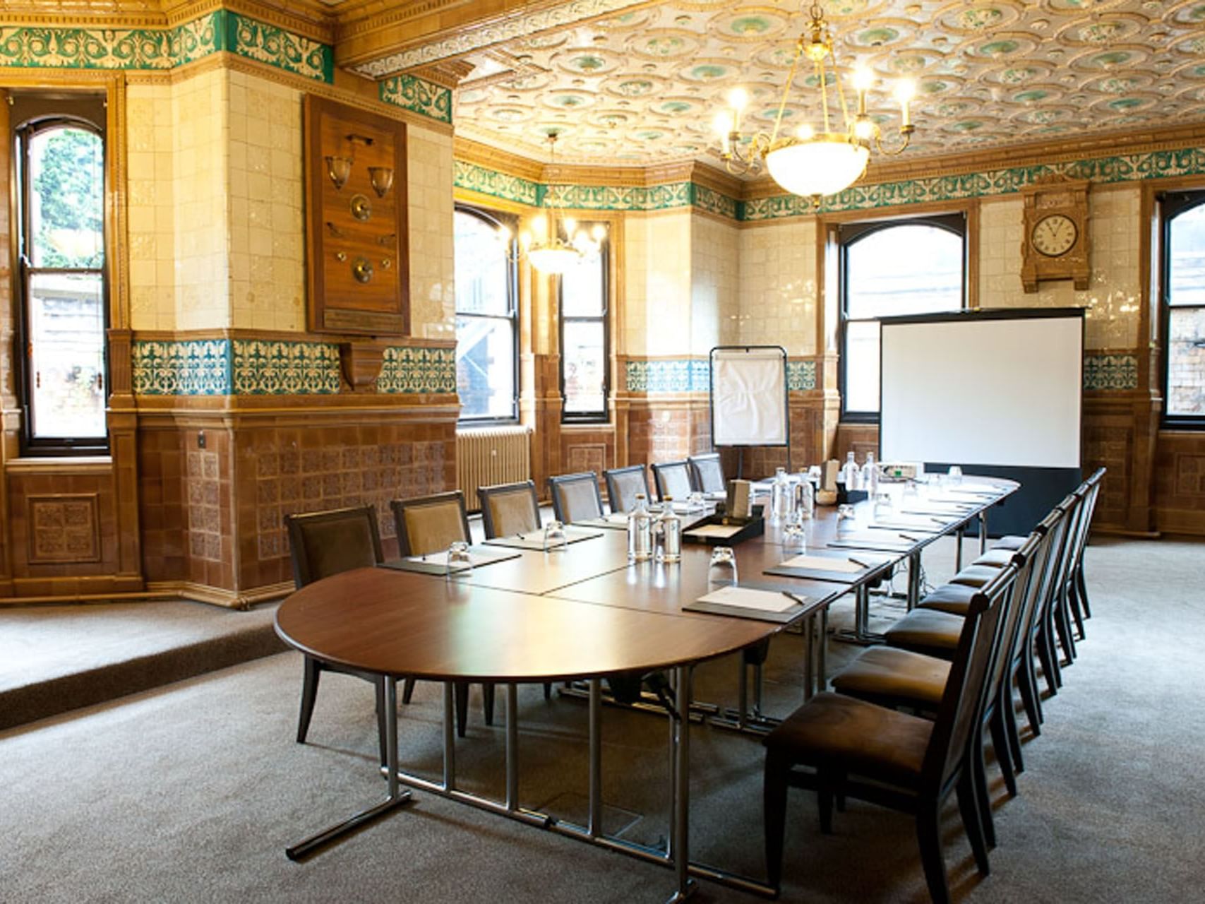 Table set-up with a screen in Tiles room, events in York at The Milner York