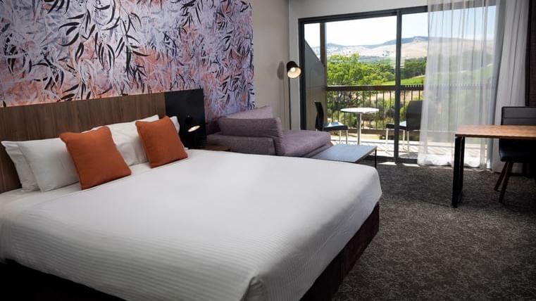 Interior of Comfy bedroom with a balcony at Novotel Barossa