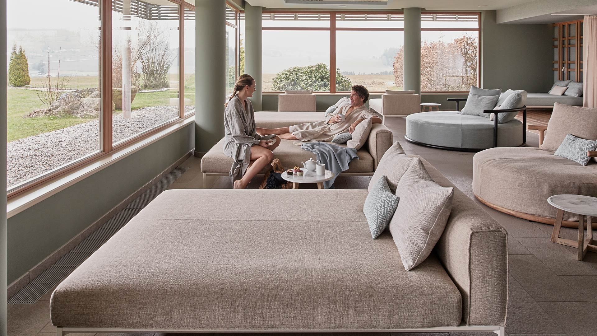 A couple enjoying tea time at Falkensteiner Genuss & Wohlfühlhotel Mühlviertel