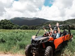 people driving 4-wheeler