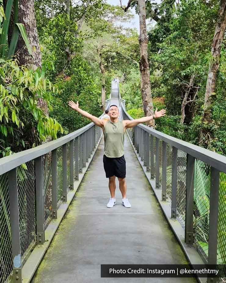 A man was standing on the bridge at Penang Hill - Lexis Suites Penang