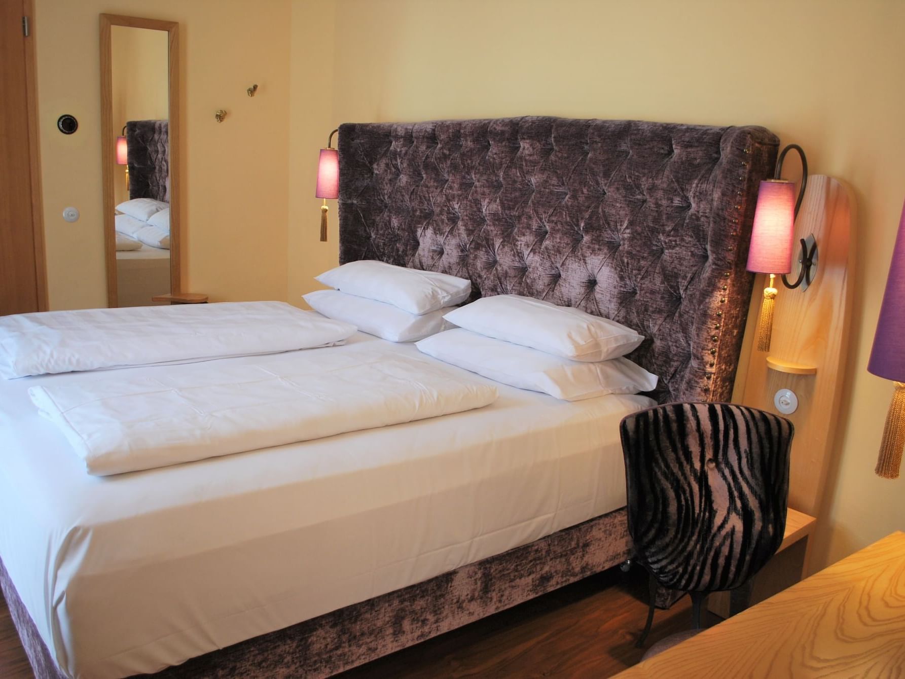 Large bed in Grand Deluxe Double Room at Classic Hotel Harmonie