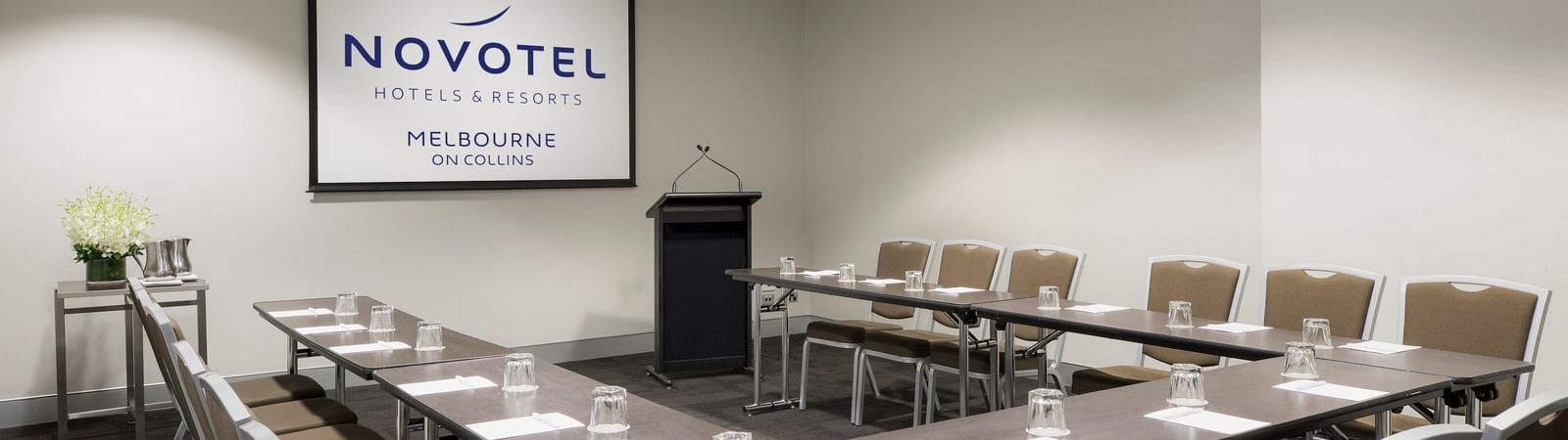 U-shaped table setup for meeting at Novotel Melbourne