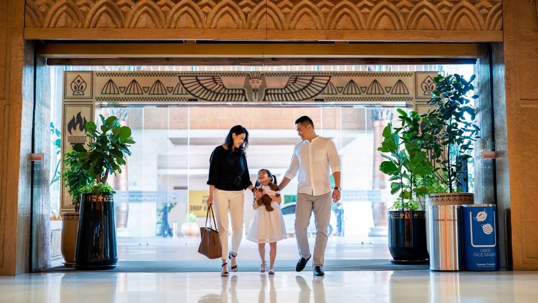 A family of 3 entering a mall near Sunway Resort