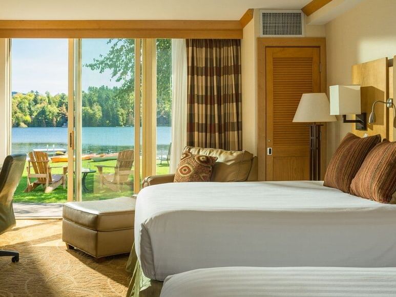 Lake view Double Queen Room with 2 beds & a chair at High Peaks Resort