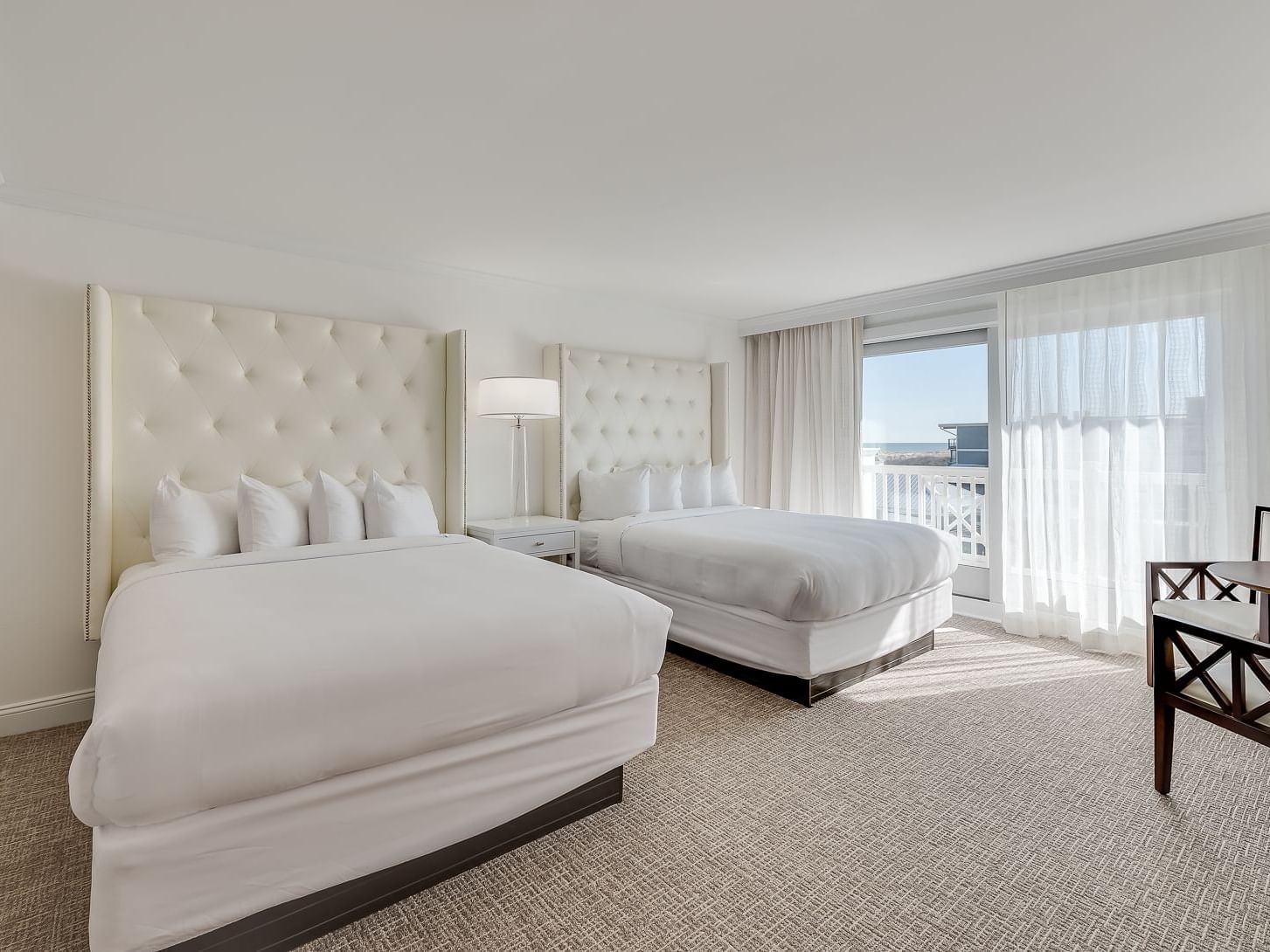 White queen beds in Signature Queen Studio at ICONA Avalon