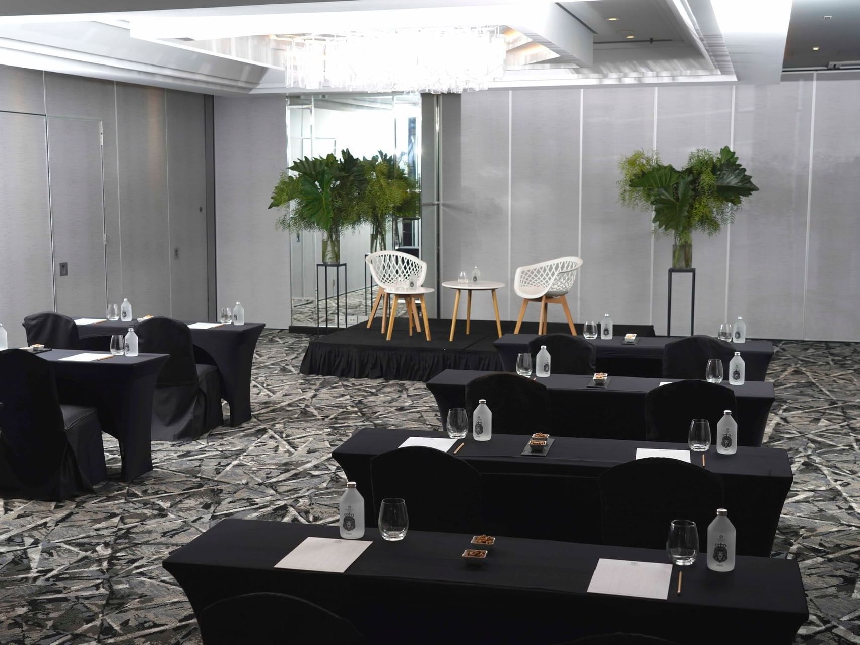 Granada meeting room arranged with black tables and chairs at Hotel Emperador Buenos Aires
