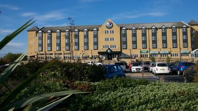 Exterior view of the Village Hotel Newcastle with the car park