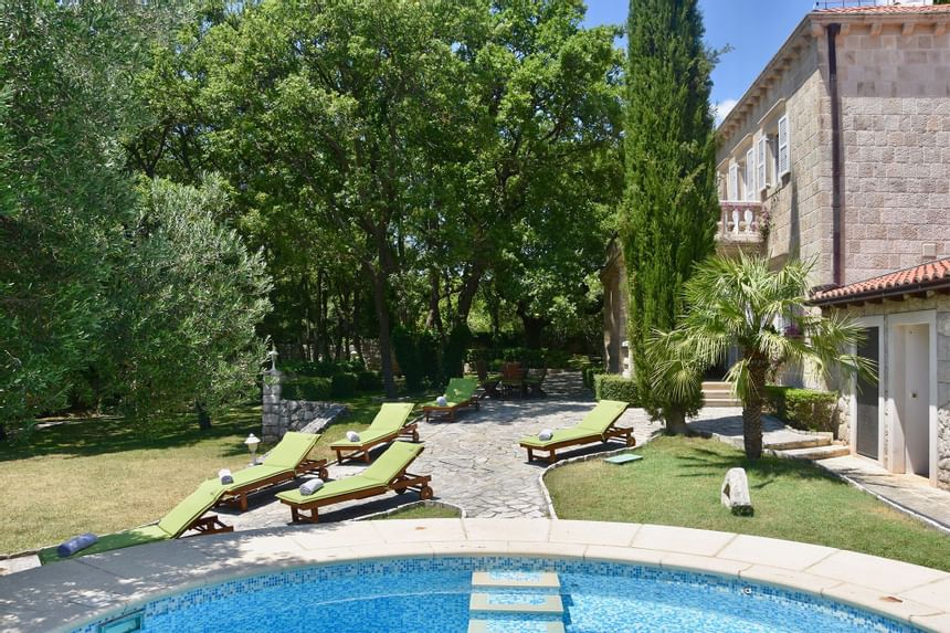 The Pool Area with sun beds at Pervanovo Villa Tereza